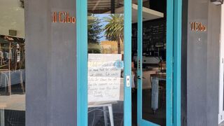 The sign in the door reads: "Unfortunately we have had to close our doors. We would like to thank you all for the support we have received over the last 15 years. Sincerely Donno & staff."